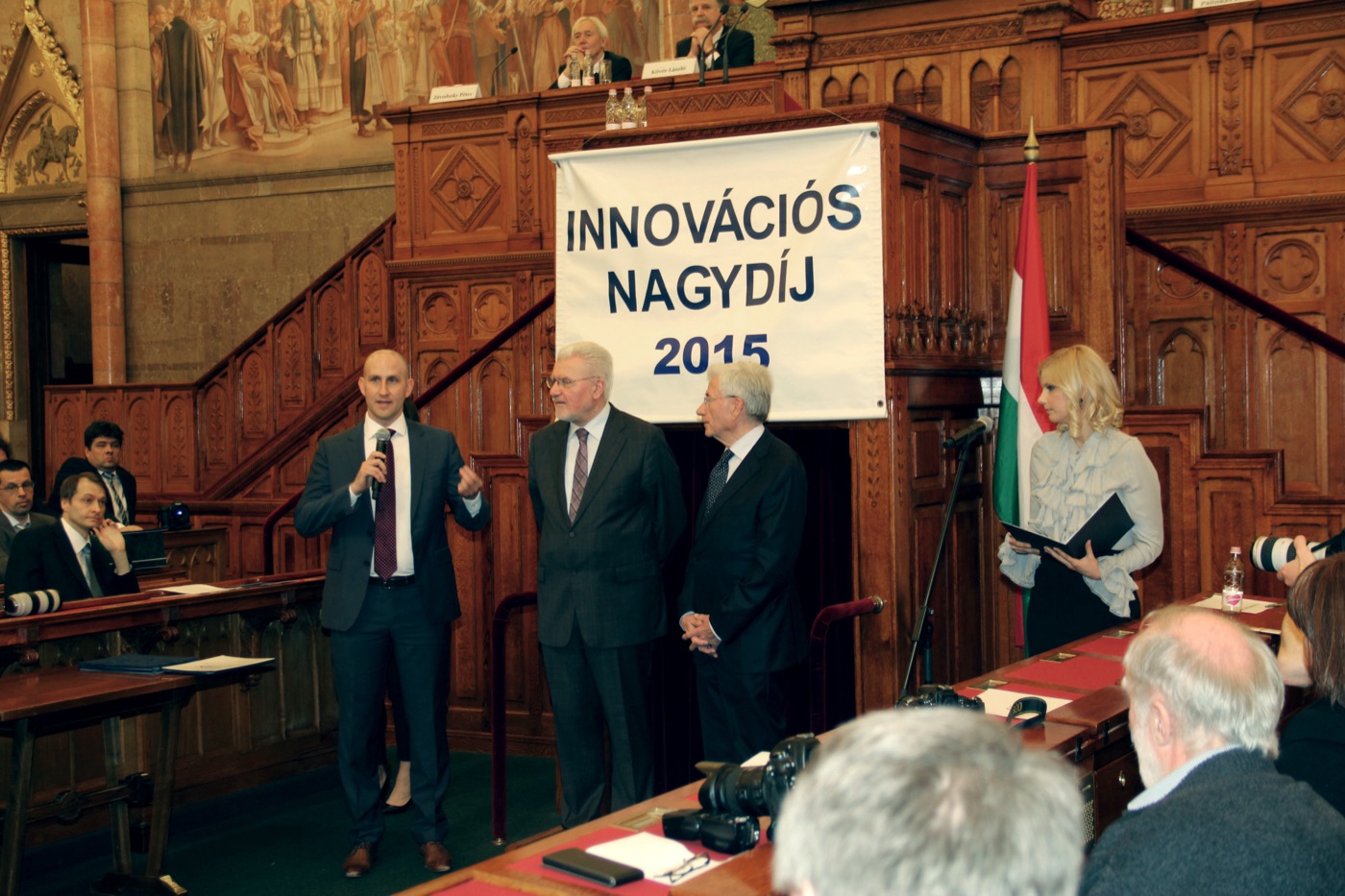 Szabolcs Kun speaking at the Hungarian Parliament after receiving the Best Startup Innovation Award from the Hungarian Academy of Sciences