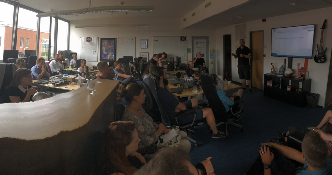 Péter Simkó presenting at an Arenim meeting (wide-angle)